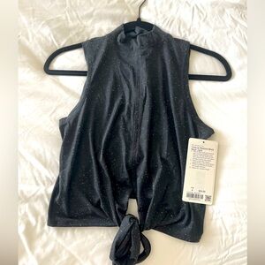 Brand new with tags. Lululemon size 4  “time to restore mock neck tank”